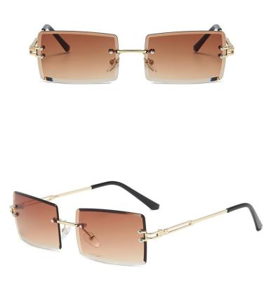 China Fashion glasses 2022 new fashionable rimless women's small frame sunglasses fit metal luxury fashionable sunglasses in stock for sale