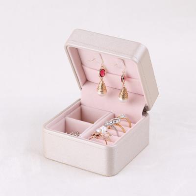 China Morden PU Travel Jewelry Box Small Portable Leather Wholesale Jewelry Storage Box For Ring Earring Necklace Gift Packaging for sale