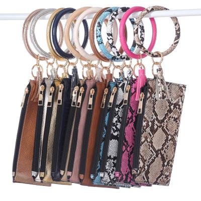 China Durable PU Leather Wristband Purse Mobile Phone Tassel Fashion Leopard Card Pendant Bag for sale