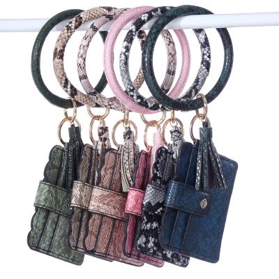 China New Durable PU Leather Tassel Fashion Bracelet Key Chain Pendant Leopard Print Mini Card Holder Coin Purse Bag for sale