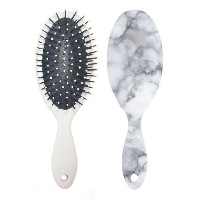 China Hotel Cushion Hair Brush Massage Hair Brush Paddle Comb Customized Logo Marble Stripe Hair Brush for sale