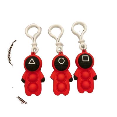 China Custom 3d silicone rubber llaveros costume squid game games pop it keychain keyring key chain with key chain for sale