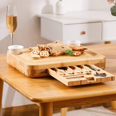 China Sustainable Extra Large Unique Natural Bamboo Cheese Board Charcuterie Tray for sale