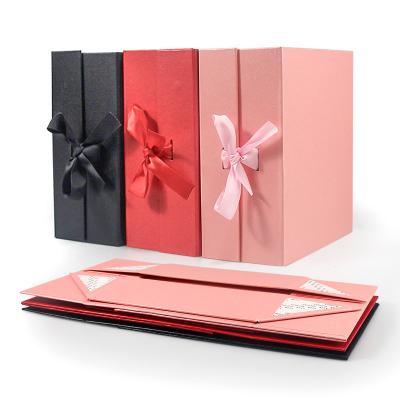 China Custom Luxury Flat Recyclable Shipping Pink Wedding Holiday Ribbon Bow Magnetic Paper Folding Packaging Gift Box for sale