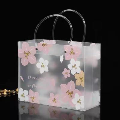 China Customized PP frosted plastic flower printed hot sale gift lady bag shopping bag packaging bags 26*20*10CM for sale