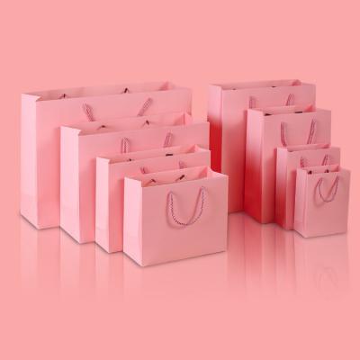 China Fashionable Wholesale Custom Rose Perfume Clothing Gift Packaging Bag Boutique Luxury Shopping Paper Bags for sale