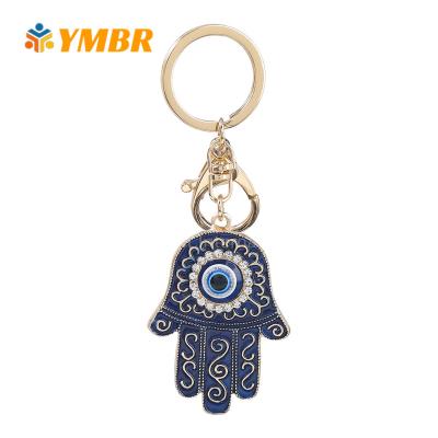 China Fashionable Amazon Hot Sale No Fade Colorful Painting Hand Shape Blue Evil Eyes Key Chains for sale