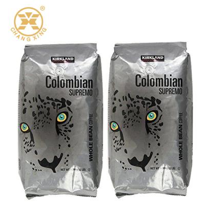 China Glossy Finish Moisture Proof Coffee Packaging Foil Pouch With Valve Silver Coffee Bag With Degrassing Valve for sale