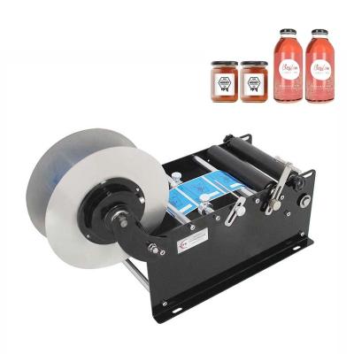 China Small manual food round bottle labeling machine price for round plastic bottles for sale