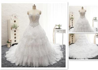 China Custom Luxury Ivory Rhinestone Beaded Appliques Sweetheart Ball Gown Tiered Chapel Train Crystal Wedding Dress for sale