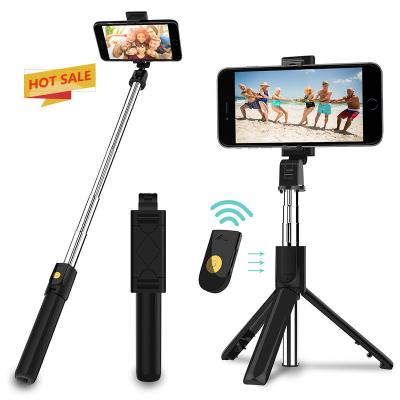 China New Style Portable Mini Selfie Stick Phone Foldable Tripod 3 in 1 Universal BluetoothTripod Selfie Phone Remote Stick for sale