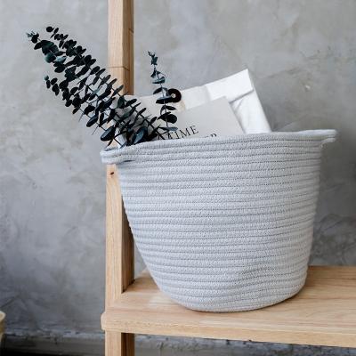 China Viable Handmade Bedroom Decorative Canvas Laundry Basket Straw Storage Basket Natural Round Straw Basket Bag for sale