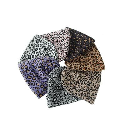 China JOINT Winter Warm Women's Classic Leopard Animal Print Pattern Soft Knitted Cuff Beanie Unisex Winter Hat for sale