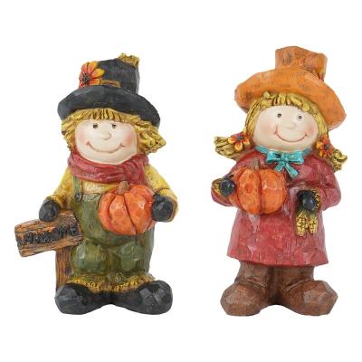 China CLASSIC Harvest Resin Sculpture Boy And Girl Statues With Pumpkin For Home Decor for sale