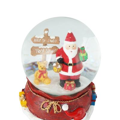 China Custom Resin Glass Santa Claus Gifts Festival Decor Home Holiday Europe Christmas Musical Snow Globe for sale