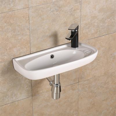 China Easy Clean White Sanitary Wash Basins Wall Mounted Corner Sink Ceramic Bathroom Wall Hung Basin for sale