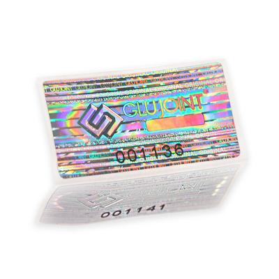 China Holographic Embossed Logo Serial Number One Time Use Bare Destructive Holographic Label for sale