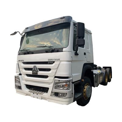 China Sinotruk HOWO 6X4 used tractor truck color options diesel engine trailer head main truck 6800X2500X3100 for sale