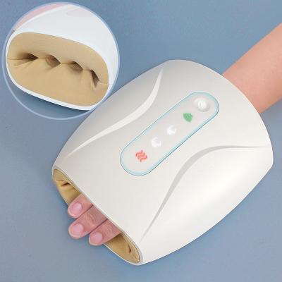 China Air Pressure Palm Handheld Cordless Vibrating Electric Fingers Hand Massager With Heat for sale