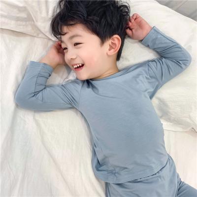 China Soft Modal Pajamas Boy's Dinner QUICK DRY Solid Color Children's Sleepwear for sale