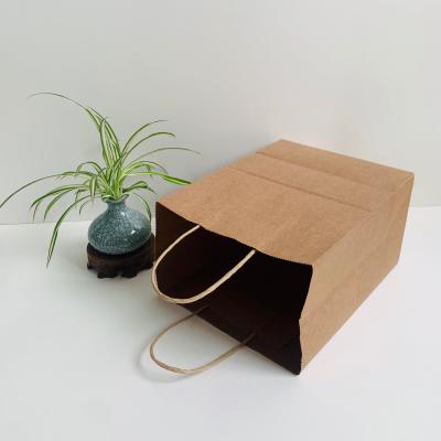 China New Type Recycled Materials High Quality Disposible Shopping Bags Kraft Paper Bags With Handle 20*11*27cm Shopping Bags Handle Kraft Paper Bags for sale