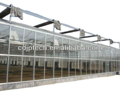 China Multi-span Agricultural Glass Greenhouses Floating Temperaed Glass Greenhouse With Movable Seedling Tall for sale