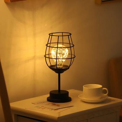 China Creative Simple Decoration Strong Iron Table Lamp Battery Cavity Wine Bottle Shape Night Light Home Lighting Decoration for sale