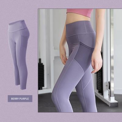 China Fashionable Breathable High Waist Sports Yoga Pants Gaiters Tummy Control Working Gaiters With Pockets for sale