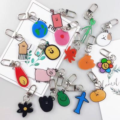 China Cute best-selling style Korea the same style for double-sided logo airpods earphone sleeve acrylic key chain pendant bag protector for sale