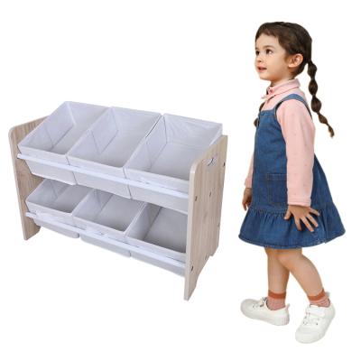 China Contemporary Children's Play Storage Shelf Wooden Front Open Baby Toy Shelf Small Nonwoven Storage Box for sale