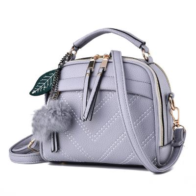 China New Style Korean Women Messenger Bags New Style PU Leather Handbag Tilted Shoulder Bag Women Cross - Body Handbags Bag Ball Tassel Bolsa for sale