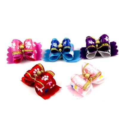 China Durable Pet Accessories Solid Claw Hair Bows With Bells For Puppies Cats for sale