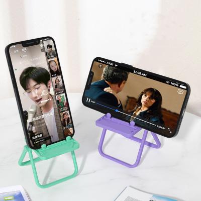 China Cute Color Adjustable Adjustable Chair Phone Holder For iPhone 13 12 Foldable Lazy Chair Phone Holder For Office for sale