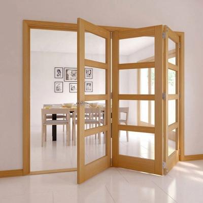 China Sound insulation pine varnish finish melamine core classic solid folding door for hotel for sale