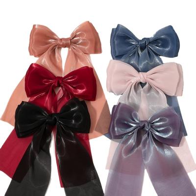 China Bright Christmas Sweet Gifts Girls Wire Hangers Custom Shiny Big Hairpins Hair Bows for sale