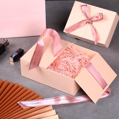 China Recyclable Luxury Custom LOGO Eco Friendly Paper Cardboard Gift Packaging Cosmetic Box With Ribbon for sale