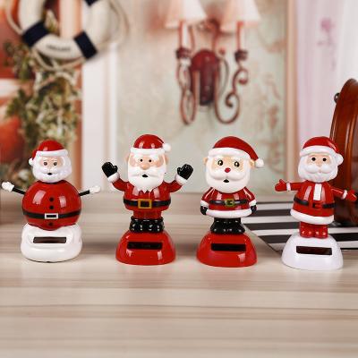 China Creative Flower Car Sun Swing Cartoon Series Solar Christmas Decoration Auto Toy for sale