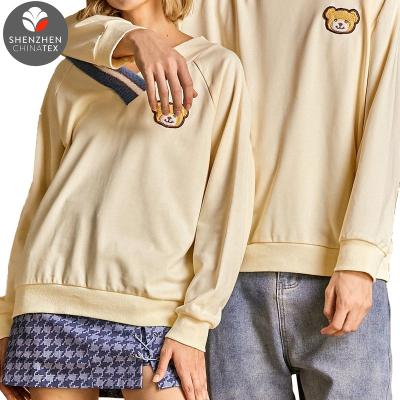 China Wholesale Breathable Fashionable Cute V Neck Contrast Badge Bear Sweatshirt Sweet Lovers Cross Matching Couples Clothes for sale