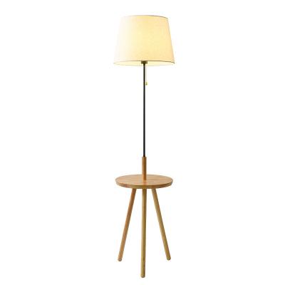 China Modern creative solid wood wood floor lamp living room floor lamp fabric table lamp hotel modern minimalist floor led table lamp for sale