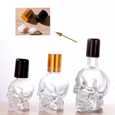 China Glass Container Skull Shape Serum Perfume Essential Oil Roll Ball Eco-friendly Recyclable Empty Bottle for sale