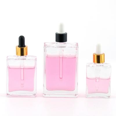 China Rectangle 30ml 50ml 100ml Square Eco-friendly Recyclable Clear Cosmetic Perfume Serum Essential Oil Glass Dropper Bottle for sale