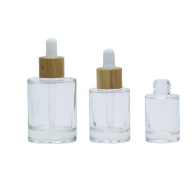 China 15ml 30ml 50ml Grain Lid Serum Essential Oil Glass Cosmetic Dropper Bottle Eco-friendly Recyclable Wooden Clear Bottle for sale