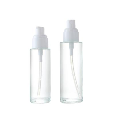 China 60ml Frosted and Clear Cosmetic Bottle Eco-friendly Recyclable Glass Lotion Glass Bottles with White Spray Pump and Top for sale