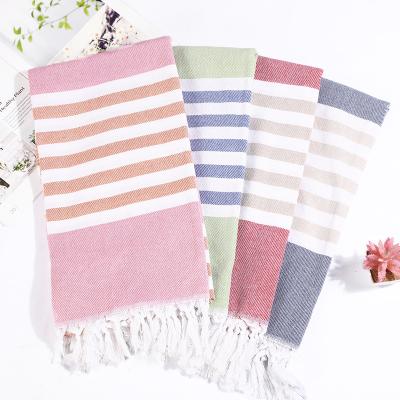 China Viable wholesale hotel boho high quality large striped swimming pool beach towel with tassel for sale