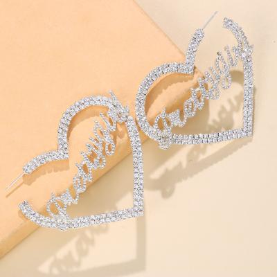 China TRENDY Fashion Hollow Out Heart Earrings Women Girl Pretty Rhinestone Love Fashion Jewelry Full Letter Stud Earrings 2021 for sale