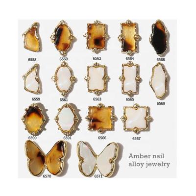 China 2021 Fashion New Design Nail Art Alloy Jewelry Leopard Print Amber Irregular Three-dimensional Metal Nail Jewelry Diamond Wholesale for sale