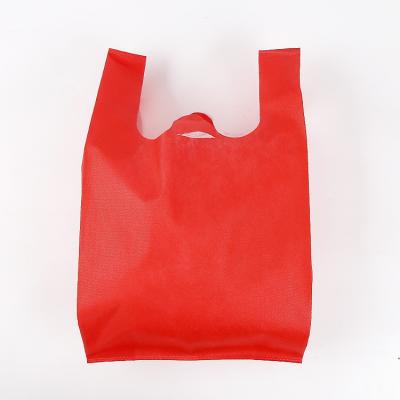 China 100% high quality eco-friendly cheap custom logos eco friendly carry non woven vest t-shirt shopping bag for sale