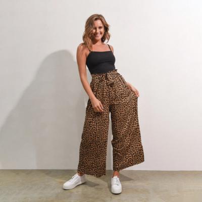 China Yuehui Anti-Static Pants Loose High Waist Loose Ladies Fashion Drawstring Printed Women's Long Wide Leg Pants 2021 for sale