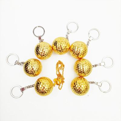 China Dupont Srulyn New Gold Golf Ball Gift Golf Competition Double Layer Synthetic Rubber Plated Golf Key Chain for sale