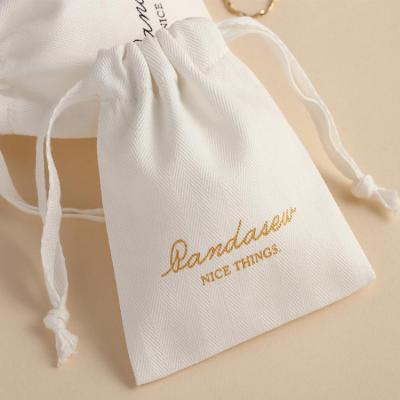 China Newest Logo Small Gift Bags Drawstring Single Canvas Jewelry Pouch Travel Bag Custom Storage Pockets for sale